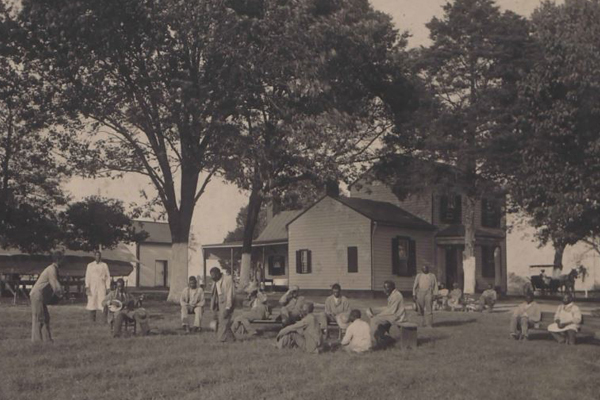 the institution, people lounging on yard